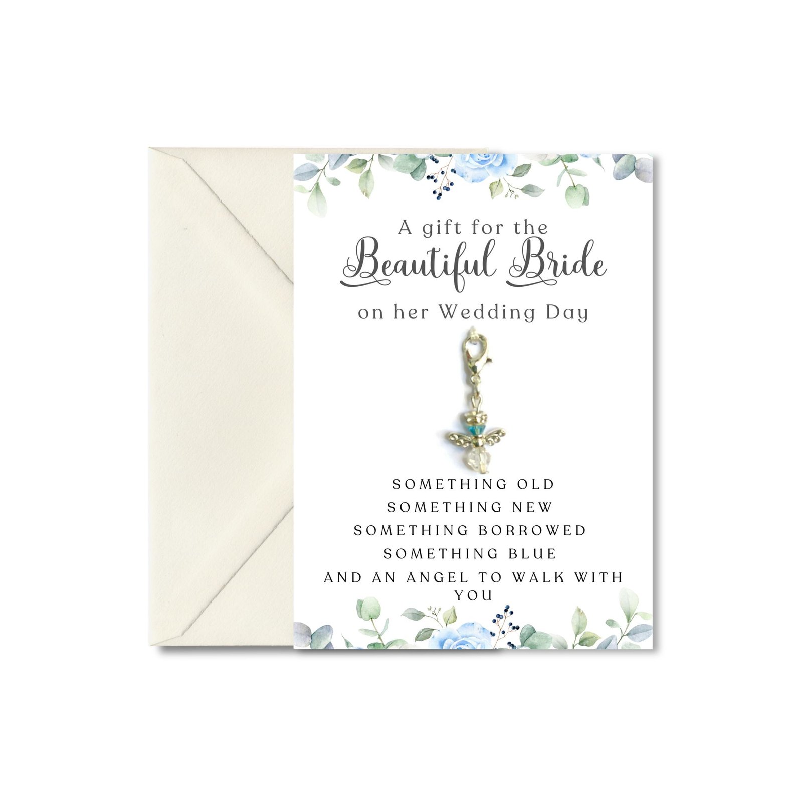 close up of guardian angel charm on a blue floral card for the bride