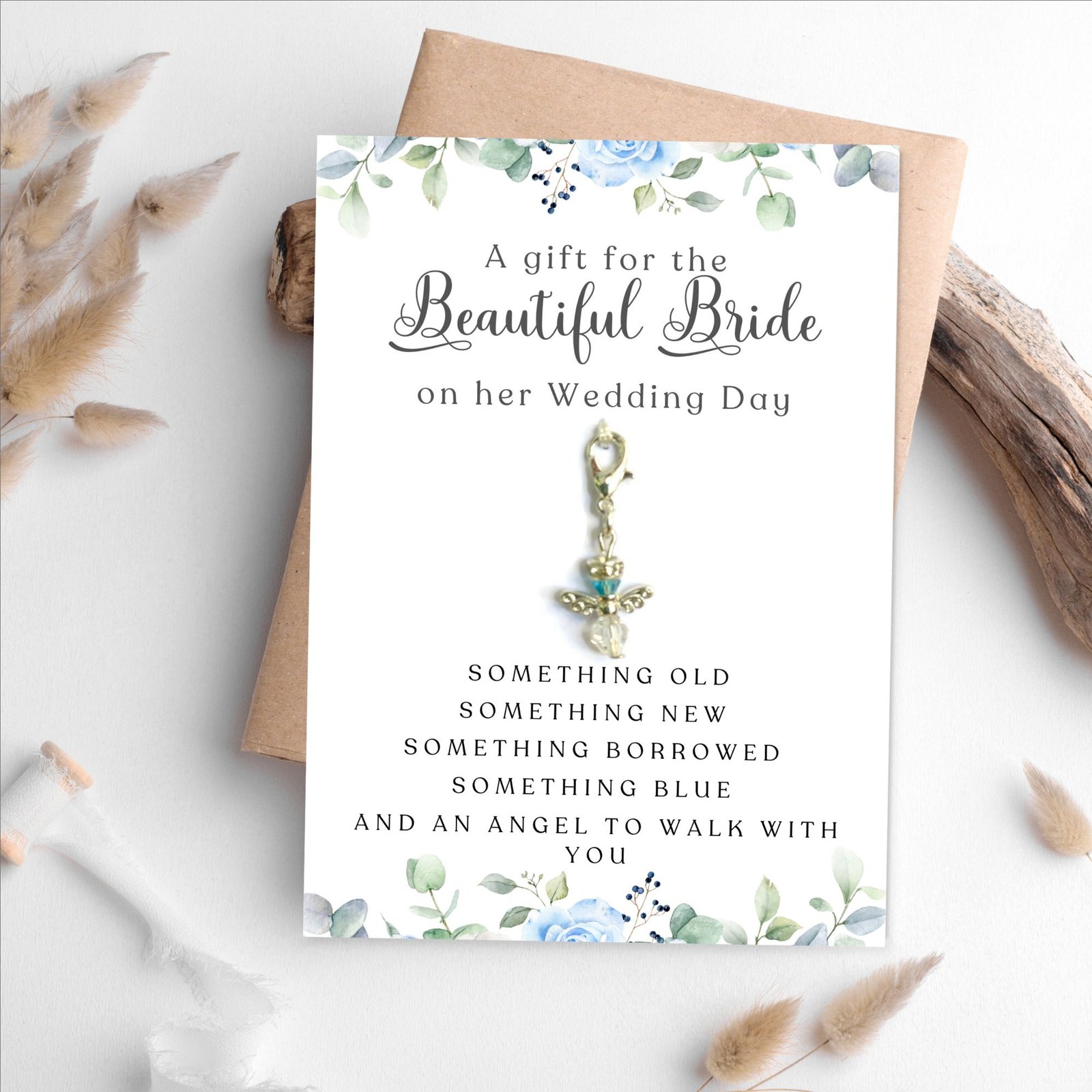 guardian angel charm on a blue floral card for the bride